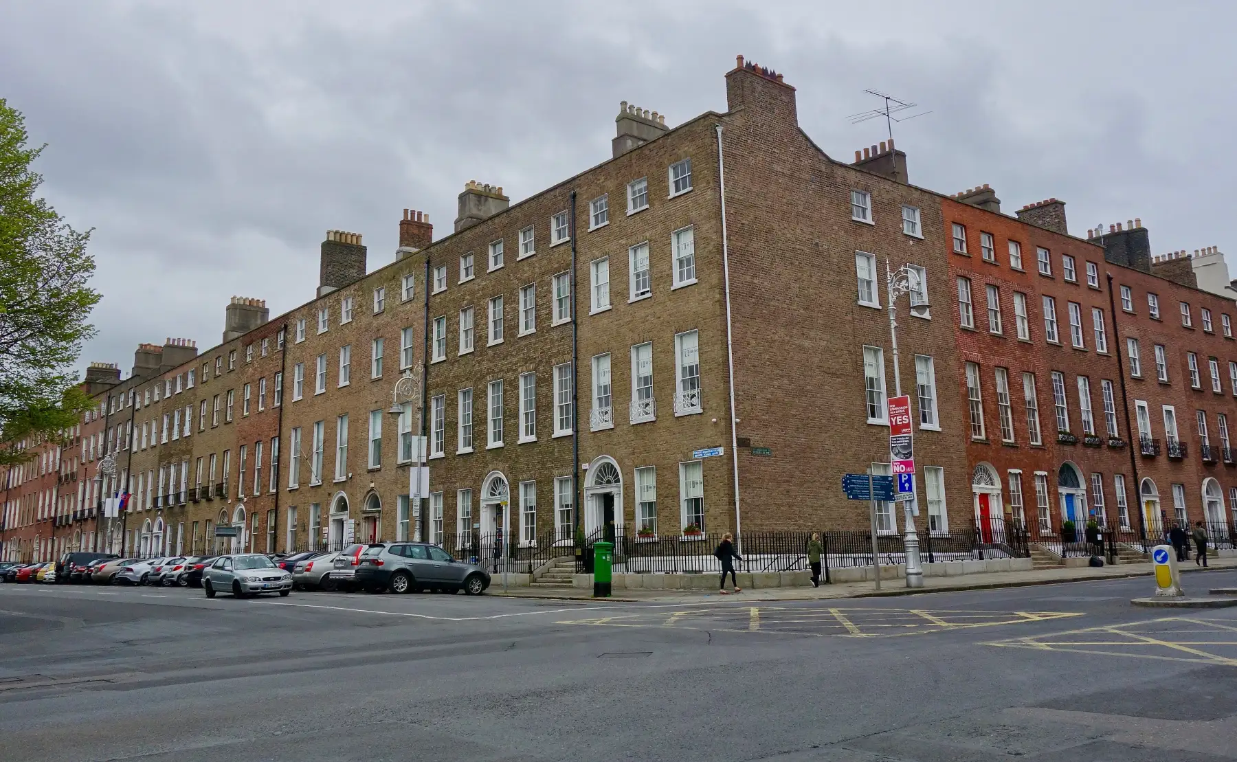 A terrace of brick Georgian townhouses with fanlight doorways on Merrion Square, Dublin
